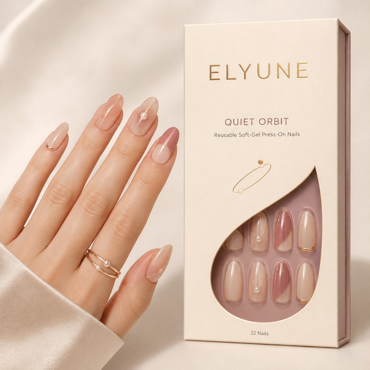 Soft-gel press-ons with delicate pearl and champagne orbit details.