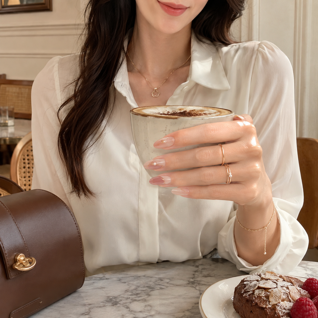 Soft-gel press-ons with delicate pearl and champagne orbit details.
